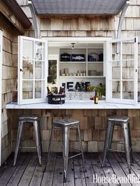 Marble shelf bar outside kitchen window, metal stools