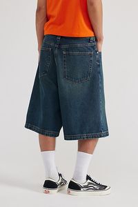 Oversized BDG baggy jorts in premium BDG denim. Longline denim shorts with a relaxed fit and zip fly. Urban Outfitters exclusive. Features BDG Astro baggy jorts Rigid BDG denim Loose longline fit 5-pocket; zip fly UO exclusive Content + Care 100% Cotton Machine wash Imported Size + Fit Model in Dark Green 6'1.5" and wearing size 32 Measurements taken from size 32 Rise: 14" Inseam: 11.5" Leg opening: 12.5" | BDG Astro Baggy Denim Jort in Dark Green, Men's at Urban Outfitters