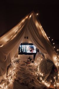 Date night and a movie under a romantic lit fort blanket | Date night ideas for couples #datenight #romantic