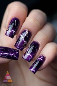 Captivate with these dark purple nails, showcasing a thunderstorm theme with lightning strikes that sizzle with electricity. For more bold and dramatic purple nail designs, head over to nailhow.com!