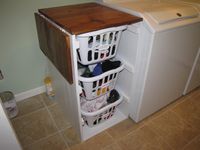 Built in fold down laundry shelf | Shorter Brook laundry basket dresser with folding table