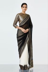 Buy #black & white half-and-half style #saree with striped pallu & border. Comes with gold-tone #sequins embellished #blouse at #azafashions Shop online now at #Azafashions.com Call +12132135273 or email contactus@azafashions.com for enquiries. #wedding #festive #ethnic #tradional #shopping #shoponline #party #reception #bride