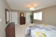 This master bedroom looks much more inviting with warm neutral walls - glad to get rid of that dandelion yellow! #parliamentpainting #housepainting #hamont #burlont #oakvilleont