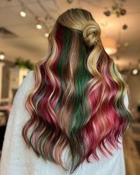 Soft blonde waves with a subtle red and green ombre effect, perfect for the holiday season. This festive style is both playful and elegant, offering a unique way to incorporate holiday colors into your look.