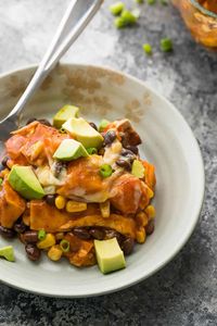 This butternut squash enchilada casserole bakes up with the bold spices of enchilada sauce, cheese, beans, butternut squash and tortillas.