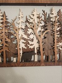 An open back design allows beautiful tree like shadows to appear on your wall behind it. The measurements for are : Extra Small - 8" x 5" Small - 17.75 x 10.75" Medium - 19" x 12" Large - 23.75" x 14.25" Other animals available on request. This is laser cut, multilayer wood art. It's made with Baltic Birch and each layer is stained a different color. It is 7 layers and each layer is 1/8". There is a Sawtooth mount on back. This is made to order, so please allow 5 days for us to make it before we