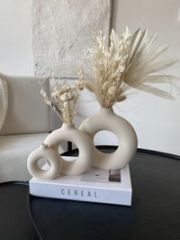 Set of 3 Circular Hollow Ceramic Vase, Small and Large Donut Vase, Hollow Round Vase, Minimalist Decor, Nordic Decor, Housewarming Gift Fast Delivery max 5 Business day!  Thank you for visiting my small business! Follow our instagram account for discounts and promotions.  https://www.instagram.com/pourtoihome Available in 3 sizes: Small: 10 cm tall, 9 cm in diameter Medium: 16 cm tall, 15 cm in diameter Large: 20 cm tall, 19 cm in diameter Just dry flowers. do not use water. Materials Ceramic : Ceramic, which is natural material, has a perfect touch as it is organic. Feel this natural material at home. -Product size please refer to the pictures. -You can message at any time!