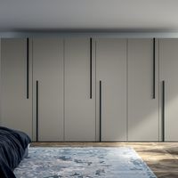 Perfect for modern bedrooms that need just as much of a stylish update as they do storage space for clothing, the Emotion Up Wardrobe by Dall'Agnese with Simply Door is a catch-all wardrobe that anyone will love. The exterior of this wardrobe features a neutral beige hue that is cut throughout by the black lines runnin