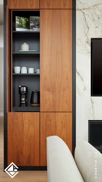 Check out this sleek coffee bar combining fixed shelves and a roll-out shelf. ☕✨ Featuring flat panel natural walnut pocket doors and extra storage below, tuck everything away when not in use and reveal a perfectly organized space for your daily caffeine fix...#CoffeeBar #PocketDoors #WalnutCabinets #StorageIdeas