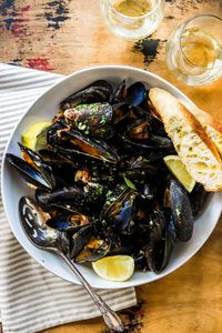 Spanish mussels are a simple and impressive recipe. Mussels are steamed with chorizo, saffron, wine, shallots, cream, and topped with fresh herbs.