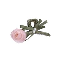 The Lovable Rosette Pink Hair Claw Clip is perfect for elegant up-dos. With a delicate, two-tone rose design crafted from mesh and satin, and adorned with two lustrous pearls, this clip will secure your hair with grace and sophistication.