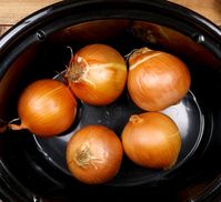 Dump whole onions with skin in slow cooker & get a delicious side to pair with any dish