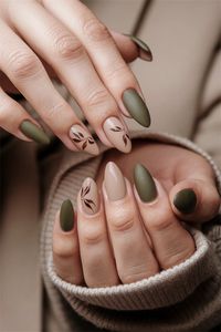 Embrace the changing season with these simple fall nail ideas that radiate elegance. Imagine soft taupe base coats enhanced with delicate leaf accents in warm hues of burnt orange and mustard yellow, capturing the essence of autumn. This style is perfect for anyone looking to add a touch of seasonal charm without overwhelming intricacy. Your nails can be both stylish and easy to achieve! Try this look and let your fingertips celebrate fall.