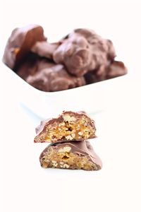 Instant Pot Chocolate Billionaires--chocolate, pecan and caramel clusters with a bit of crispy crunch from Rice Krispies. These candies have the perfect texture of chewiness, crispiness and softness. 