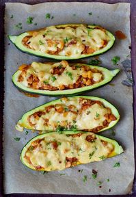 Stuffed zucchini boats with bell pepper, chickpeas, and vegan cheese! This is a simple vegetarian weeknight dinner, side dish or entrée which contains healthy wholesome ingredients. The recipe is meat-free, plant-based, relatively low-carb, and easy to make! You can use your favorite veggies and sub chickpeas for other beans or lentils. #stuffedzucchini #zucchiniboats #vegandinner #elasrecipes | elavegan.com