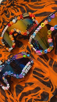 Custom Rave Glasses! Three different shades of glasses and custom beads. Completely customizable with bead colors and artist names. Artist we have are -Sullivan King -LSDream -Subtronics -Kai Wachi -Lost Lands And more to come!