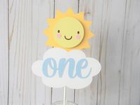 "This adorable cake topper will add a personal touch to your little sunshine's cake! Sunshine and cloud topper is 7\" tall, attached to an 8\" stick and reads \"one\".   For more coordinating items, click here: https://www.etsy.com/shop/sweetheartpartyshop?search_query=sunshine Thanks for visiting Sweetheart Party Shop!  If you have something specific in mind and would like a custom creation, feel free to message me and I'll do my best to accommodate your needs!"