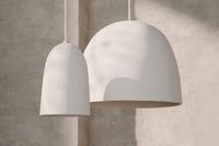 Made with a distinct stoneware that features a grainy, raw texture, the Speckle Pendant is a ceramic ceiling lamp with a natural look and feel. Crafted by hand, the lamp has a fluid, organic silhouette. The matching ceramic canopy unites the lamp’s unique expression.