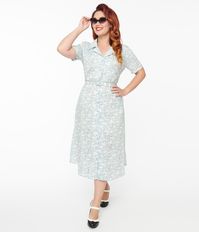 This charming 1940s style dress features a lovely light blue hue adorned with cute white cat prints, perfect for adding a fun touch to your wardrobe. The included belt cinches at the waist for a flattering silhouette, while the front button-up design is accented with heart-shaped buttons for an extra dose of sweetness. With short sleeves, a classic collared neckline, and side pockets, this dress is sure to become your new favorite go-to piece for any occasion.Available in sizes XS-4X while supplies last.