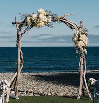 Salty Girl Sturdy Driftwood Wedding Arches are handcrafted specifically to be used again and again. Choose a statement-making Salty Girl arch for your wedding venue. This gorgeous driftwood arch will complete your wedding couple's special day creating a stunning backdrop for lasting photos of the wedding couple and wedding party. This is a great option for wedding venues to offer a driftwood arch as an add-on option to the wedding package. With sturdy tripod legs, this arch is designed to be mov