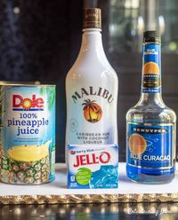 This Blue Hawaiian jello shot recipe with Malibu rum is to die for! I love the combination of pineapple juice and coconut rum...almost like a blue pina colada! The blue color is perfect for summer and my 4th of July party. #entertainingdiva #jelloshots #partyideas #4thofjuly #cocktail #cocktailrecipe