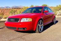 This 2001 Audi A6 Quattro was purchased new by the current owner through Audi of Salt Lake City in Utah, and it was specified in Tornado Red with an Onyx Ambition interior. Power is from a 4.2-liter V8 that drives all four wheels through a five-speed automatic transaxle and a Quattro all-wheel-drive system with a Torsen center differential. The car was optioned with the Sport and Premium Packages, which together added front sport seats, a sport-tuned and lowered suspension, two-row seat heati...