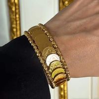 This Ein Yabrud pleated Gold Stack lira bracelet boasts a unique stacked design, adding elegance and sophistication to any outfit. Made with 100% genuine lira coins, it is a statement piece that showcases your love for history and culture. Elevate your style with this one-of-a-kind bracelet.