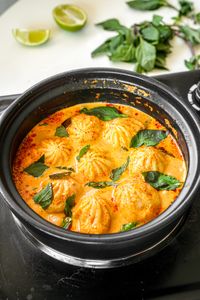 Soup Dumplings in Thai Red Curry Sauce - One Happy Bite