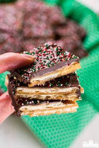 Christmas Crack is the stuff dreams are made of! Not only is it easy, but it's also incredibly addicting! You'll need saltine crackers, butter, brown sugar, chocolate chips, and about 20 minutes to make it! Bring this candy recipe to every holiday party this year! #Christmascandy #nothermometerneeded