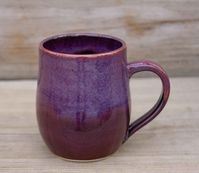 Purple Mug Handmade Coffee Mug Tea Mug Pottery Ceramic Stoneware Pottery Gift Modern Pottery Coffee Mug Tea Cup Purple Beauty For Women Materials: stoneware, glaze Capacity: 12 fluid ounces This classic mug will be sure to enliven your day with rich elegance! The purple glaze has light speckles and depth that has to be seen in person to be fully appreciated. These mugs feel great in your hand and hold 102ounces of your favorite beverage. The mug was hand-thrown on my wheel, bisque-fired, glazed