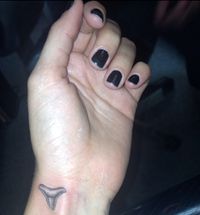 dr. woo shark tooth tattoo