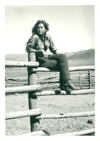 Jane Fonda sitting on a fence on the Ranch