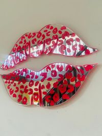 💋Wall  Lips💋 Solid acrylic laser cut lips They look absolutely lush as part of a gallery wall...but also on their own as a real statement piece. Gorgeous silver mirror acrylic which has been reverse engraved and hand inked with neon pink on the reverse. So all the work is done on the reverse and doesn't disturb the stunning reflection on the front 😍😍 Dimensions  Width 25cm Height 15cm *Attachments not included. We suggest using an extra strong double sided tape to attach to the wall