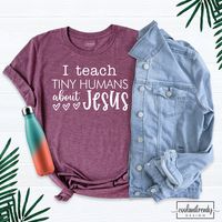 I Teach Tiny Humans About Jesus Shirt, Christian Ladies Tshirt, Bible School T-Shirt, Christian School Shirt, Teacher Christian Shirt. Hi! Welcome to our store. It's good to see you here. Our aim is to offer you first-class clothing in your most beautiful moments with our graphic t-shirts that we designed or designed with your ideas. I am sure you will like our designs for your family, friends and you. IMPORTANT MATTERS FOR ORDERING: 1-) Please check and review all photos. 2-) Our sizes are true