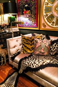 We love homes that push the boundaries with a Maximalist, eclectic style. Here, James Kivior has blended textures, framed silk scarves and animal prints in his "Pretentious Home" exuding dark and moody walls, filled to the brim with things he loves; cushions, art, velvet and decorative accessories.