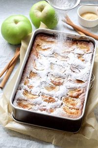 This simple Dorset Apple Cake (Traybake) made with cooking apples (Bramley) and gently spiced with cinnamon is incredibly moist & delicious. Perfect on its own with cup of tea or slightly warm with ice cream or cream for dessert. #dorsetapplecake #bramleyapples #applecake #cinnamon #appledessert