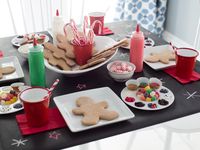 Keep the kids entertained with their own party activity. Set up a gingerbread decorating station, complete with to-go boxes so little ones take the treats with them when they leave. >> http://www.hgtv.com/design/make-and-celebrate/holidays/kids-gingerbread-cookie-decorating-party-pictures?soc=holidaypinparty