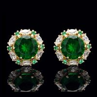 Absolutely gorgeous and unique halo design stud earrings featuring round created emeralds and marquise white simulated diamonds. These dazzling stones are professionally set in halo design heavy post settings with secure screw-back fastenings. All crafted from 14K solid gold. Also available in yellow gold, and twelve birthstone colors. Our created diamonds are synthetic simulants that feature brighter D color , FL / VVS1 clarity and ideal cut making them visually indistinguishable from natural d