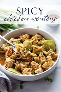 These spicy chicken wontons feature a juicy chicken filling and are tossed in an incredibly flavorful spicy chili lime sauce. Serve them as an appetizer or a main entree!