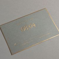 Vera Wang Engraved Gold Bordered Light Grey Wedding Invitation