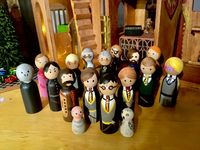 Handmade Harry Potter set - DIY made with materials found at Michaels craft store   Materials: Wooden castle dollhouse, wooden peg people, Wood stain, fine and coarse sandpaper, hot glue gun, gorilla glue, acrylic paint, miniature decorations, battery operated string lights