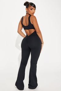 Available In Black, Tangerine, And Hot Pink. Active Jumpsuit Scoop Neck Padded Cut Out Detail Sleeveless Super Soft Ruched Medium Impact Stretch Body 77% Polyester 23% Spandex Inner Mesh 82% Nylon 18% Spandex Imported | Body Burn Super Soft Active Jumpsuit in Black size XS by Fashion Nova