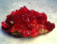 RUBY RED GEMSTONE GEODE CRYSTAL ROCK SOAP Pomegranate scented This soap is hand poured in bright hues of red wine, ruby, vermilion and shimmering gold. Very realistic with many layers of color. This soap would make a great gift, guest bathroom soap or even something special for yourself! If you have any questions feel free to contact me. This listing is for 1 soap that weighs 6 ounces total. Measurements are 4 1/2" x 2 1/2" x 2" Your soap will be packaged in a clear cello bag and tied with a sat