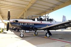 an air force plane parked in a hanger