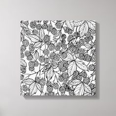 a black and white drawing of berries on a canvas mounted to the side of a wall