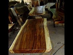 several pieces of wood sitting on top of each other in a room filled with furniture