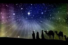 the three wise men are traveling through the desert with their camels in front of them