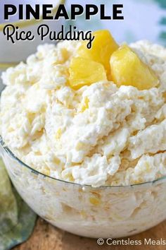 pineapple rice pudding in a glass bowl on top of a wooden table with text overlay