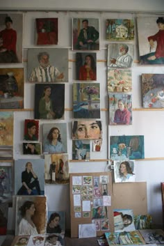 many paintings and pictures are hanging on the wall