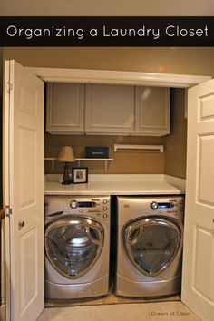 an open laundry closet with washer and dryer in it